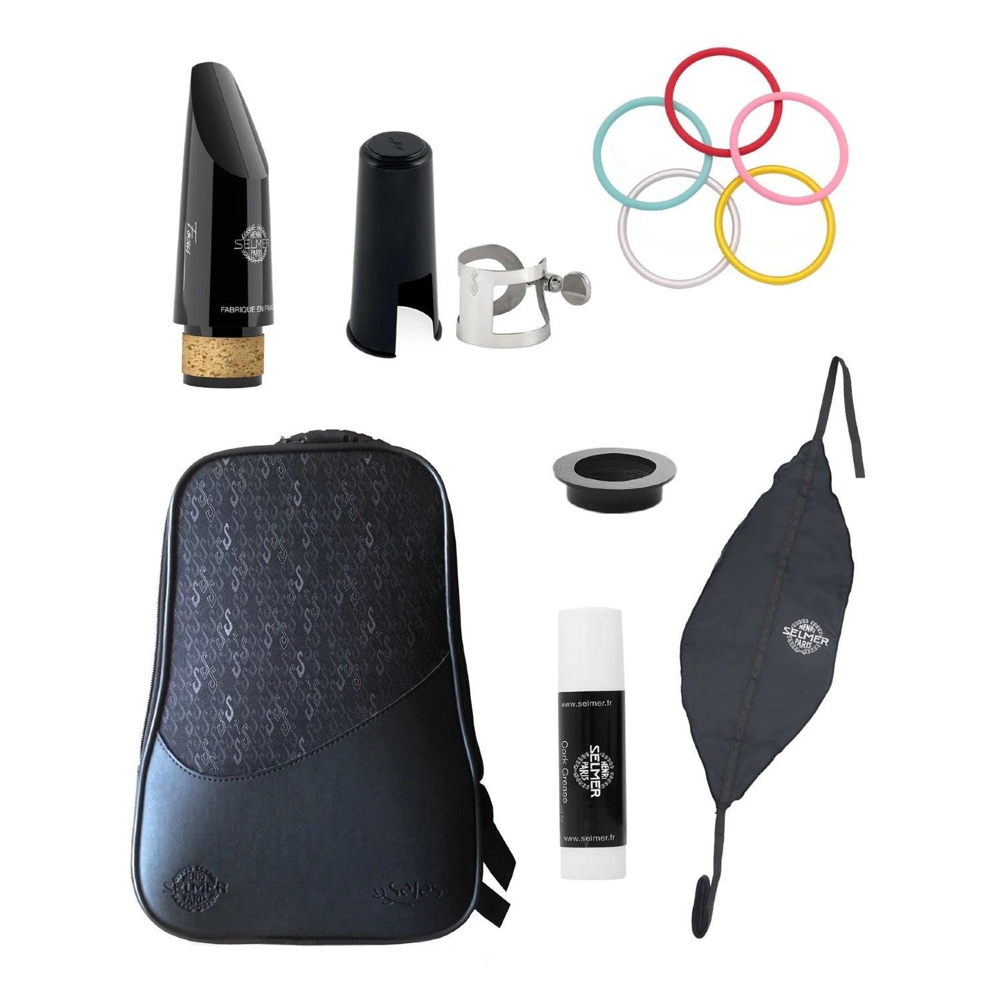 Complete Selmer Prologue accessory package, including Selmer Focus mouthpiece, ligature and cap, colored bell rings, tone hole insert, swab, cork grease, and case on a white background