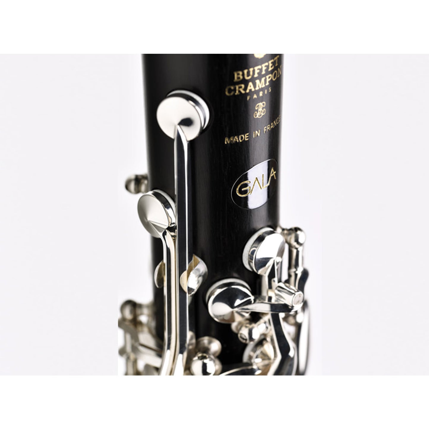 closeup image of the Buffet Crampon logo and round silver Gala badge on the upper joint