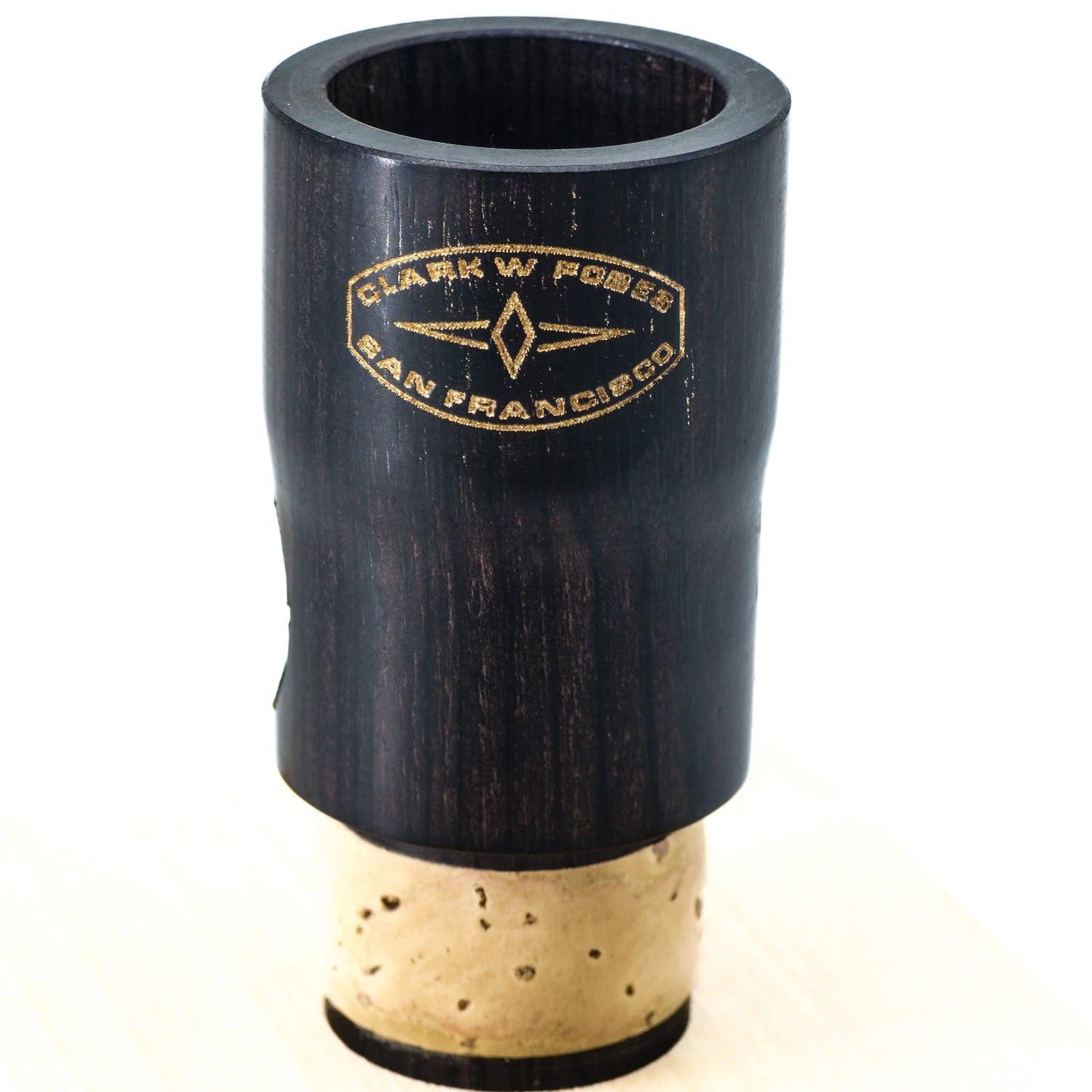 Frontal view of grenadilla wood Fobes Eb extension, showing closeup of logo and beautifully colored wood grain