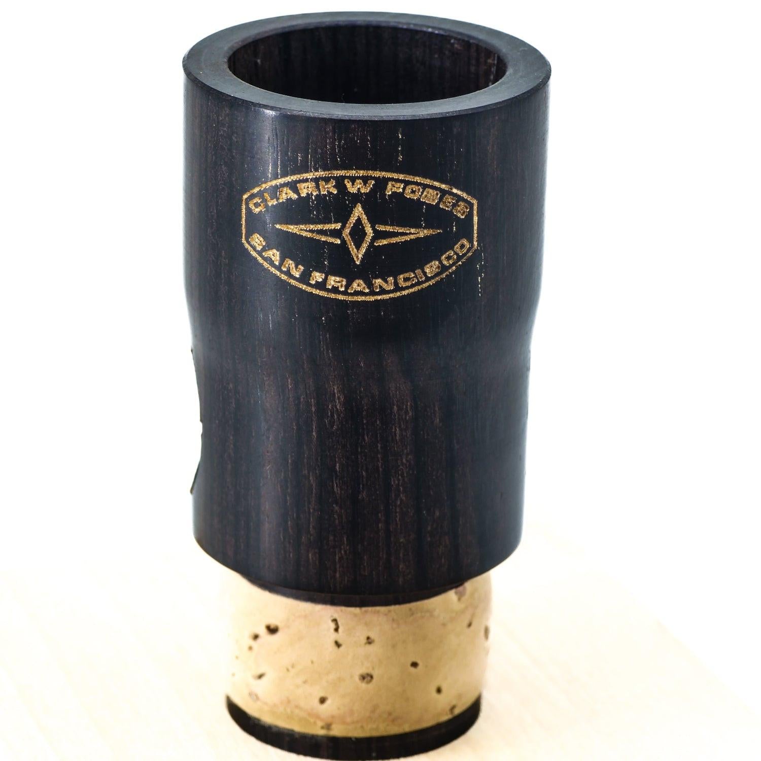 Frontal view of grenadilla wood Fobes Eb extension, showing closeup of logo and beautifully colored wood grain