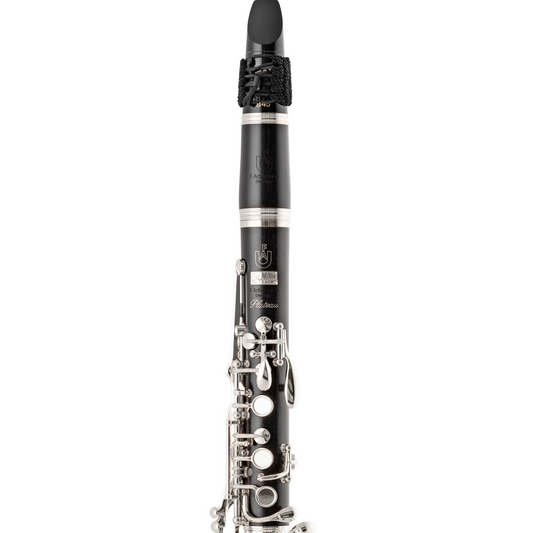 upper joint, barrel, and mouthpiece of Uebel Superior Plateau clarinet against white background