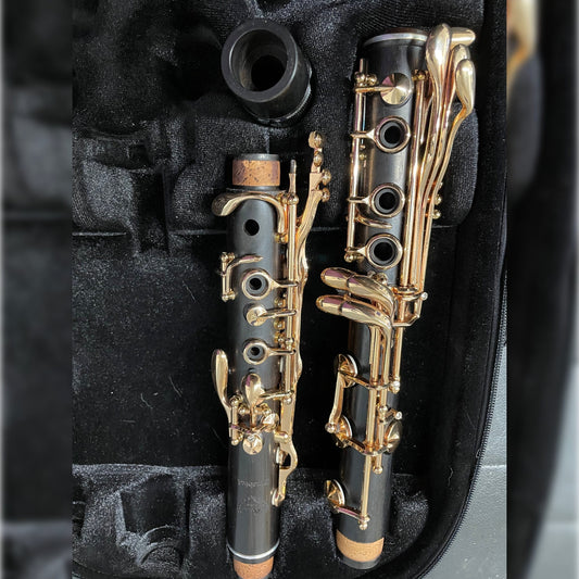 Preowned rose gold edition Firebird A clarinet in case, lower joint facing up