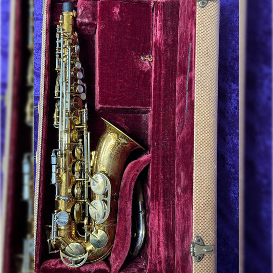 King Super 20 alto saxophone laying in open case, with red lining