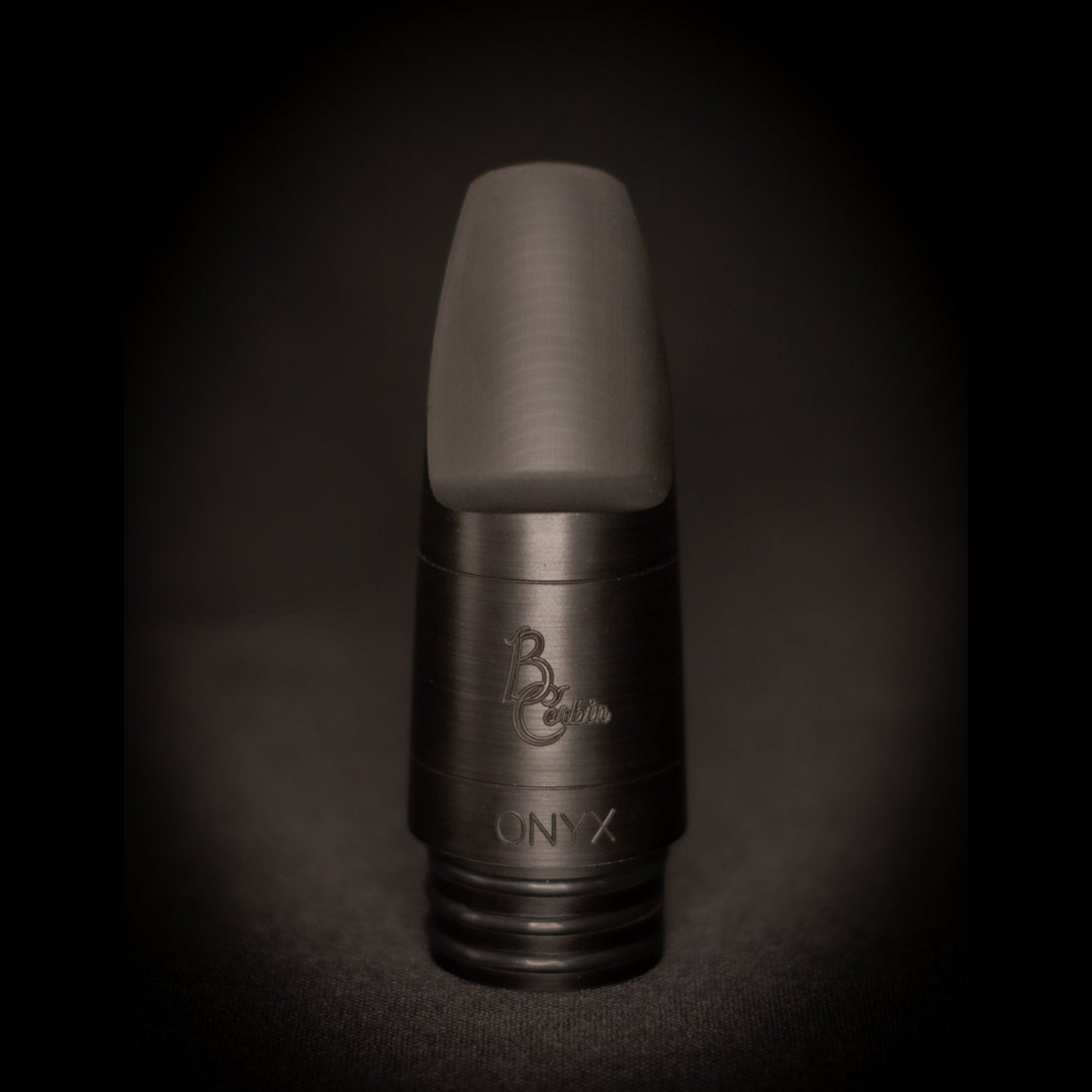 Brian Corbin Onyx bass clarinet mouthpiece on a black background