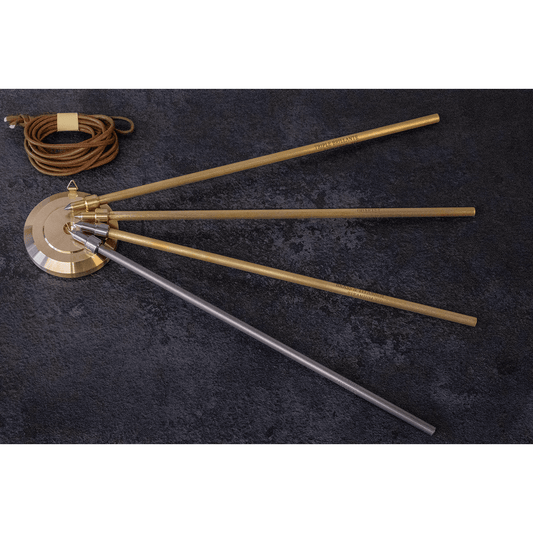 Mitsuke Endpins - pin models fanned out on stopper (top to bottom: triple brilliante quartet, brass & titanium with titanium tip, titanium), with stopper attachment cord