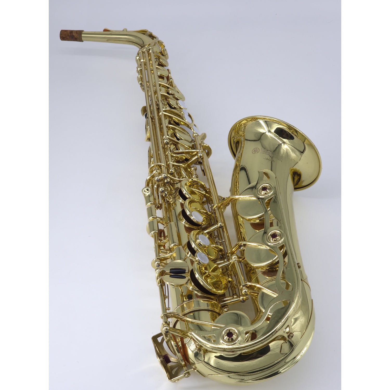 Gold saxophone on a white background