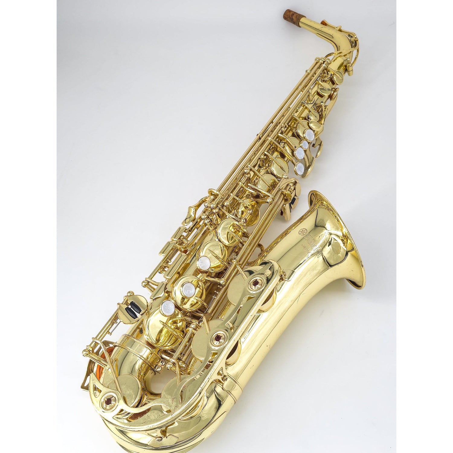 whole Yamaha 52 alto sax on white background, keys facing up