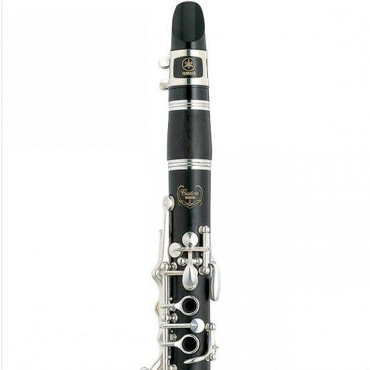 Closeup of upper half of Yamaha 881 Eb clarinet, showing Custom logo engraving