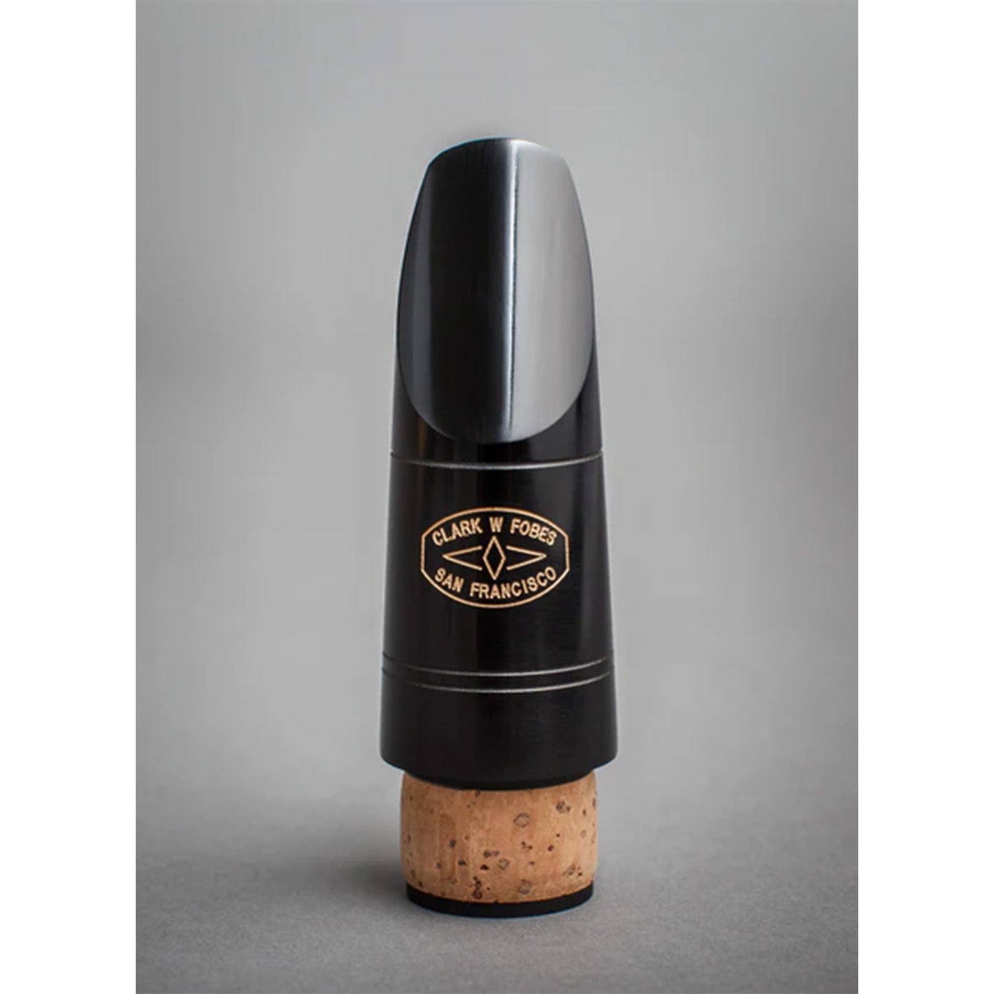 Photo of black Fobes 10k Bb mouthpiece on gray background