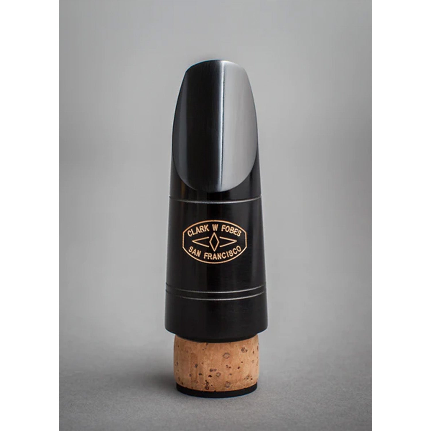 Photo of black Fobes 10k Bb mouthpiece on gray background