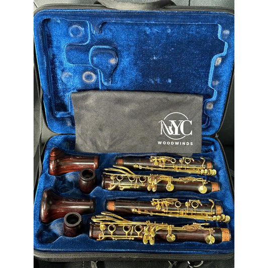 Pair of cocobolo and gold-plated Backun MoBa clarinets in Bb and A, in their blue-lined Protec double case